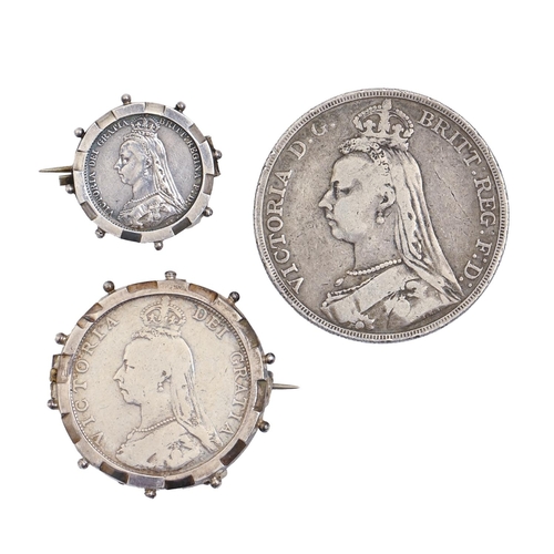 695 - Silver coins. United Kingdom crown 1889 and two other Victorian mounted silver coins (3)... 