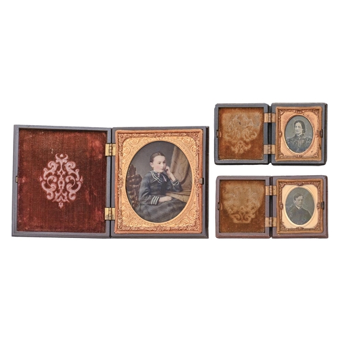 707 - Victorian photographs. Three wet collodion positives ('ambrotypes') of two ladies and a gentleman, o... 