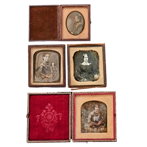 709 - Daguerreotype portraits of three women and a girl with a doll, maroon morocco case or part thereof, ... 