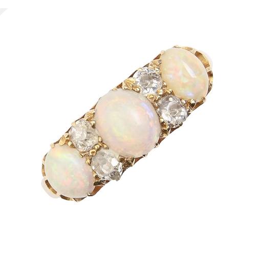 8 - An opal and diamond ring, early 20th c, marked 18, other marks rubbed, 5g, size N