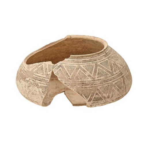 879 - An Indus Valley painted terracotta bowl, 2000BC, with geometric pattern, 28cm diam