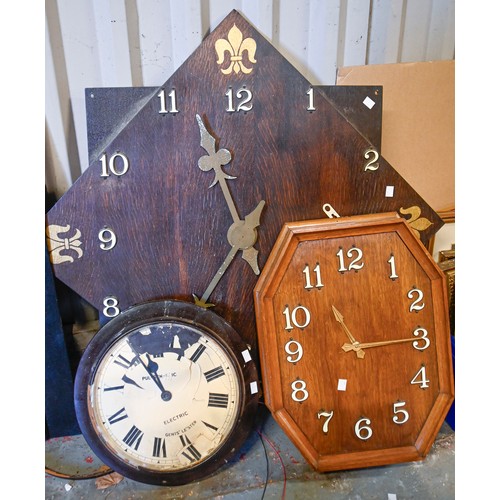 1391 - An oak octagonal electric wall clock, c. 1950, white plastic Arabic numerals, another two electric w... 