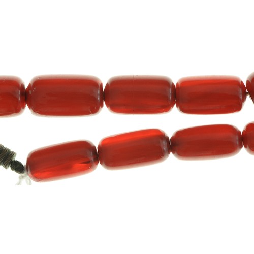 189 - A necklace of oblong faturan beads, 38g