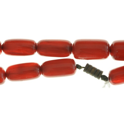 189 - A necklace of oblong faturan beads, 38g