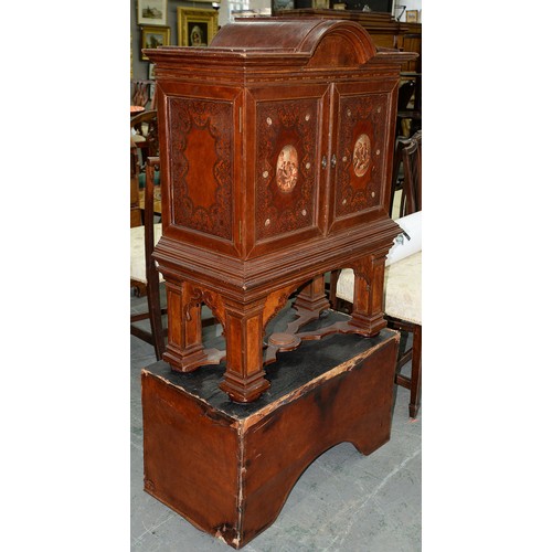 1212 - A Spanish tooled leather writing cabinet, c1920, with breakarched pediment and fitted interior with ... 