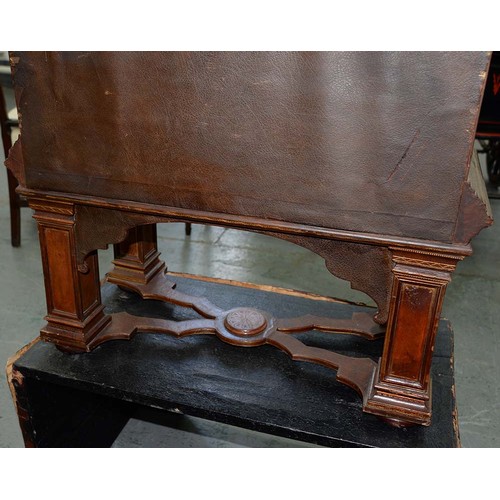 1212 - A Spanish tooled leather writing cabinet, c1920, with breakarched pediment and fitted interior with ... 