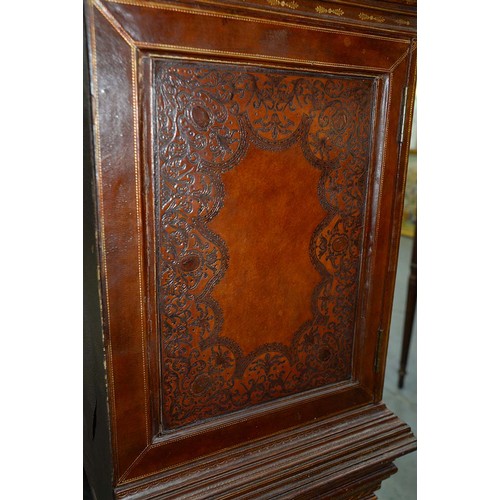 1212 - A Spanish tooled leather writing cabinet, c1920, with breakarched pediment and fitted interior with ... 