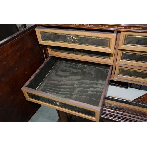 1212 - A Spanish tooled leather writing cabinet, c1920, with breakarched pediment and fitted interior with ... 