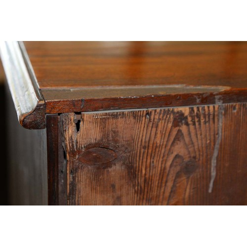 1324 - A George III serpentine mahogany chest of drawers, the top with moulded lip and angles above brushin... 