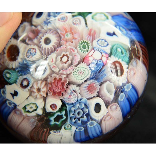 590 - A Bacchus close-packed millefiori paperweight, c1850, including silhouette canes of, possibly, Queen... 