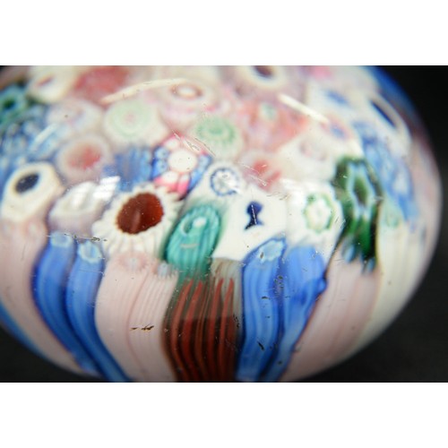 590 - A Bacchus close-packed millefiori paperweight, c1850, including silhouette canes of, possibly, Queen... 