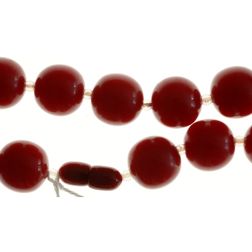 194 - A necklace of faturan style cherry red beads, 73g