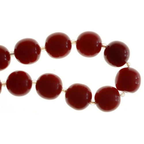 194 - A necklace of faturan style cherry red beads, 73g