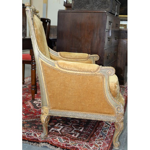 1274 - A French carved painted and gilt Bergere, early 20th c, in Louis XVI style