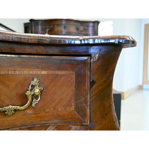 1326 - A Louis XV kingwood and rosewood commode, Scandinavia, with quarter veneered top and fitted with thr... 