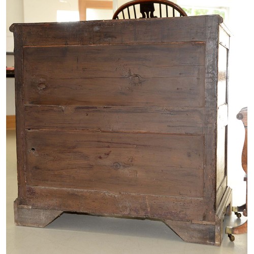 1340 - A Queen Anne walnut and oak chest of drawers, with brass axe head handles, on bracket feet, 87cm h; ... 