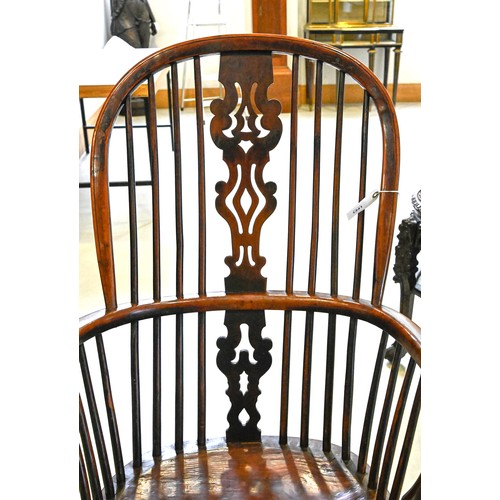 1341 - An early 19th c yew and elm wood Windsor chair, North Nottinghamshire, on turned legs with crinoline... 