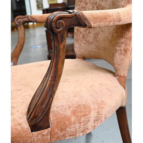 1304 - A pair of mahogany armchairs, in George III style, on shell carved cabriole legs, the padded arms te... 