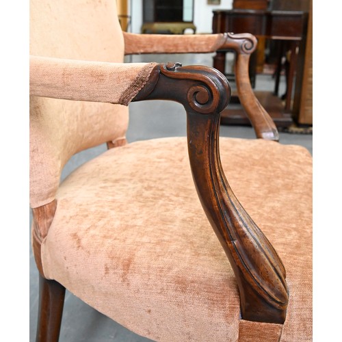 1304 - A pair of mahogany armchairs, in George III style, on shell carved cabriole legs, the padded arms te... 