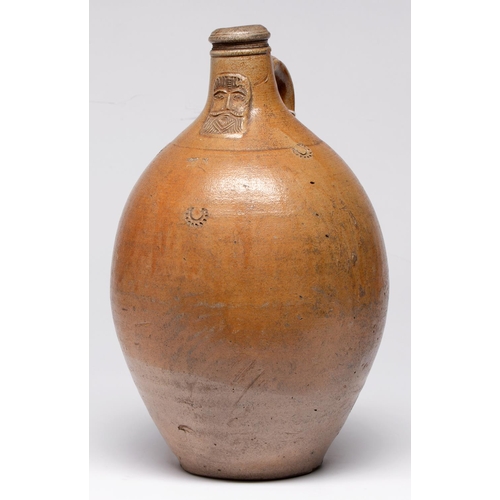 547 - A German saltglazed brown stoneware Bartmann bottle, c1700, applied with bearded mask and impressed ... 