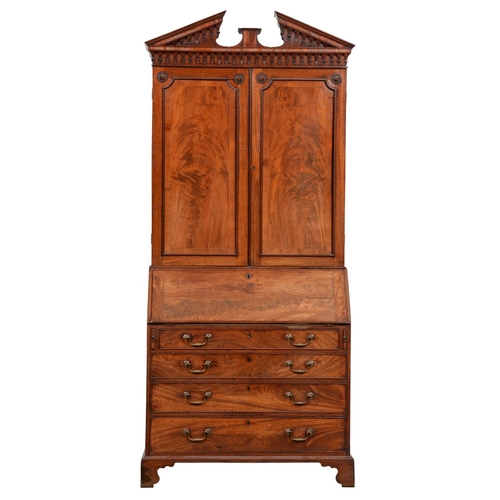 1030 - A George III mahogany bureau bookcase, with open triangular pediment and pear drop frieze, fitted wi... 