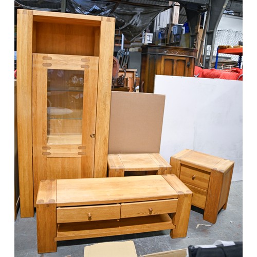 1038 - An oak four-piece sitting room suite, late 20th c, comprising a cabinet, a coffee table, occasional ... 