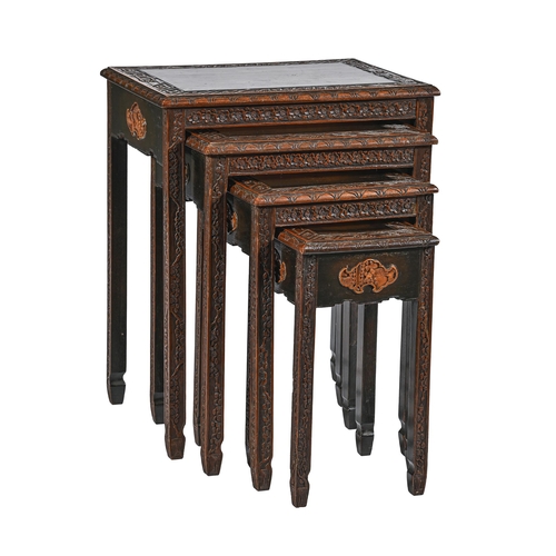 1006 - A set of Chinese carved and stained wood quartetto tables, c1930, with bat shaped panels to each sid... 