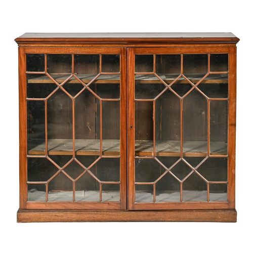 1013 - A walnut bookcase, early 20th c, fitted with adjustable shelves enclosed by glazed doors, 107cm h; 3... 