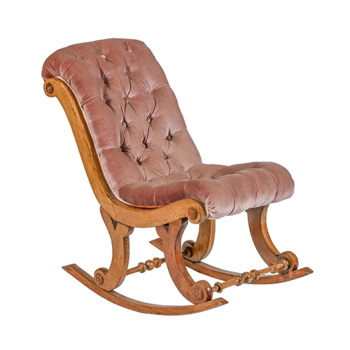 1022 - A Victorian walnut child's rocking chair