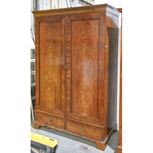 1044 - A Victorian mahogany wardrobe, the doors with flame figured panel above drawer, bracket feet, 206cm ... 