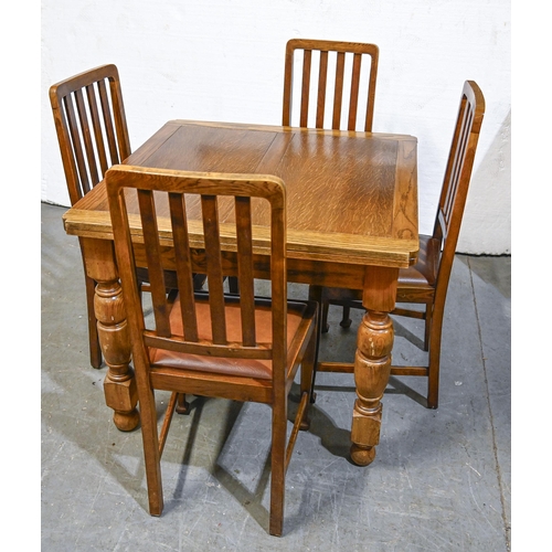 1046 - An oak draw leaf dining table, on turned legs and a set of four oak dining chairs, c1930s, table 74c... 