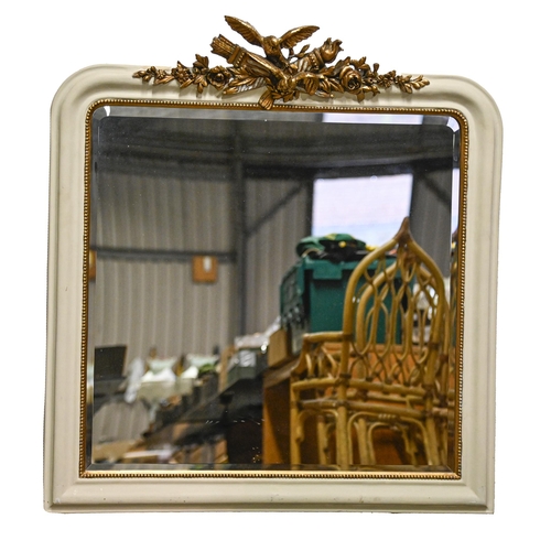 1074 - A painted and giltwood over mantel mirror, 20th c, crested by trophy of love, 113 x 106cm... 