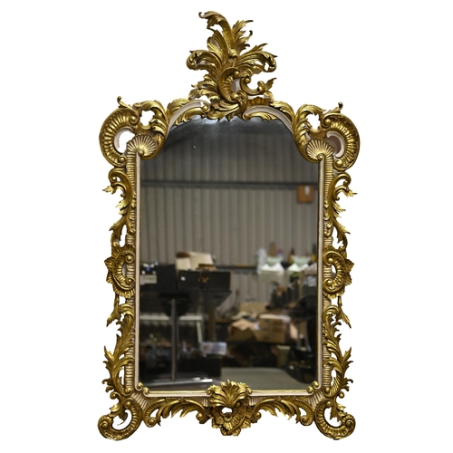 1075 - A giltwood mirror, late 20th c, in Rococo style, 155 x 94cm