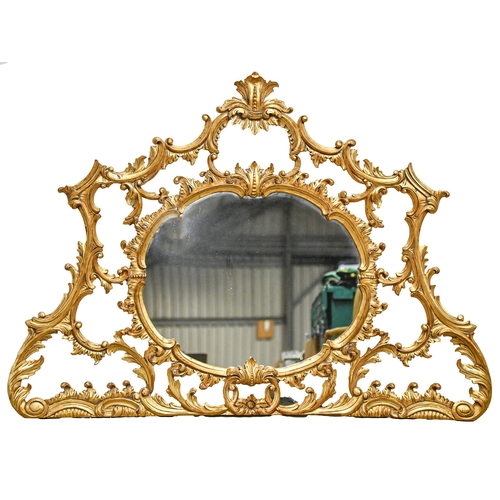 1076 - A giltwood over mantle mirror, late 20th c, in Rococo style, 116 x 156cm