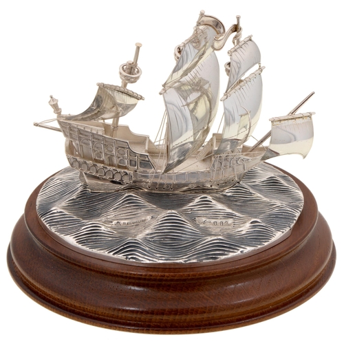 326 - An Elizabeth II silver model of The Golden Hind, on turned oak base, 12cm h, by M J Softley, London ... 