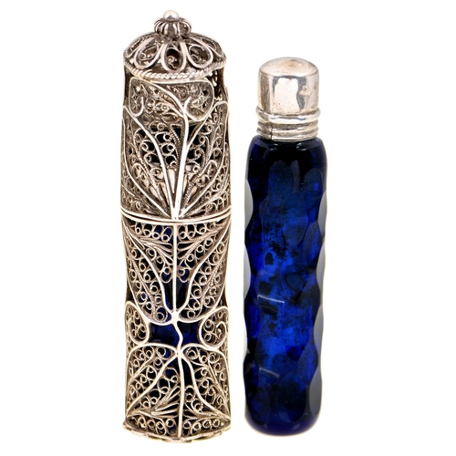 367 - A faceted blue glass scent bottle and threaded silver cap and an associated silver filigree scent bo... 