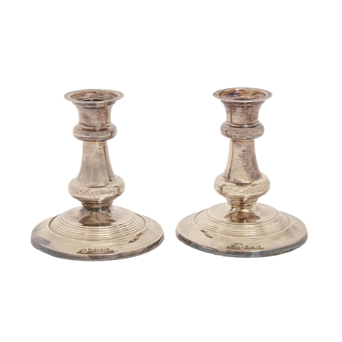 380 - A pair of Edwardian dwarf silver candlesticks, 11.5cm h, by Martin, Hall & Co, Birmingham 1905, ... 