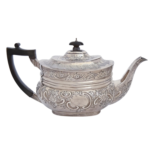 387 - A Victorian silver teapot, crisply chased with flowers and C-scrolls, the domed lid with integral jo... 