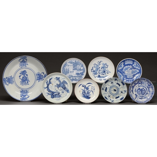 464 - Eight Vietnamese bleu de hue saucers, including a saucer-dish, 19th and 20th c, mostly sketchily pai... 