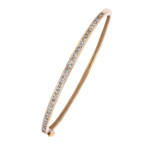 49 - A diamond bangle, in 9ct gold, 58mm (internal), marks rubbed, 8.9g