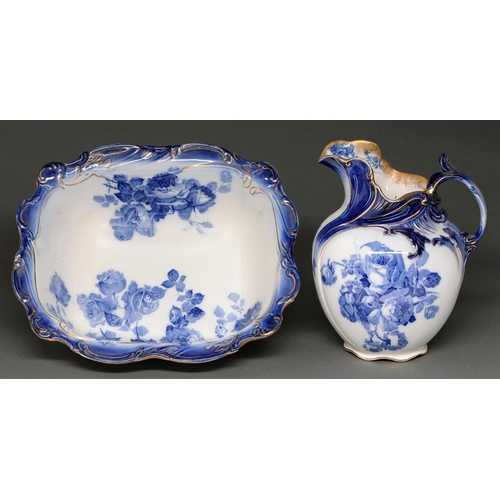 494 - A Royal Doulton flow blue gloire-de-dijon chamber jug and basin, c1910, basin 42cm l, printed mark a... 