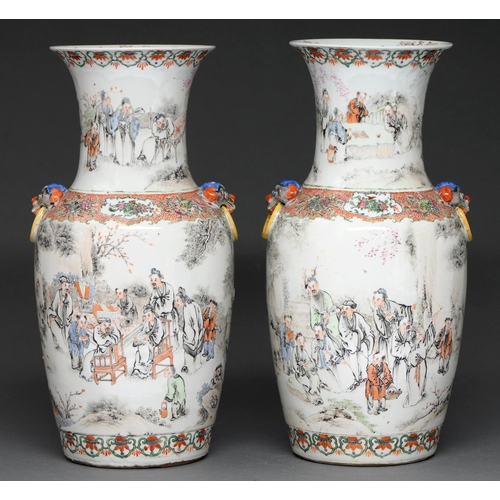 495 - A pair of Chinese famille rose vases, 19th c, with mask handles, painted in two registers with group... 