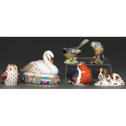 551 - Four Royal Crown Derby paperweights and two Beswick birds, various sizes, printed marks, all boxed... 