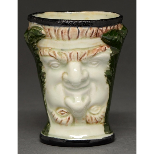 564 - A creamware Janus beaker, 19th c, 90mm h