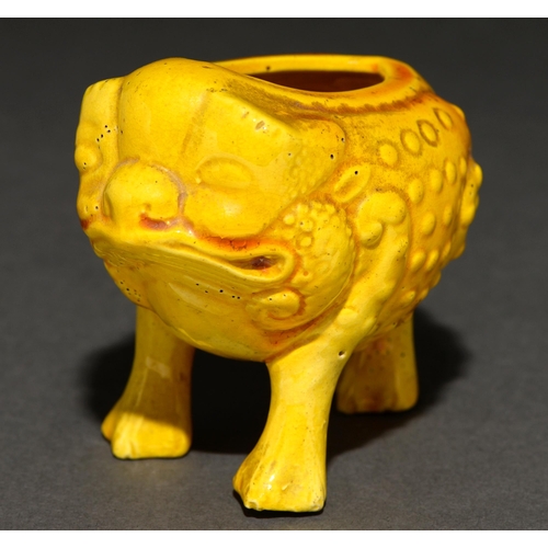 566 - A yellow glazed art pottery miniature vessel in the form of a grotesque toad, in the manner of Burma... 