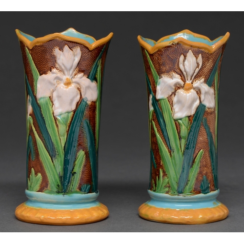 568 - A pair of Victorian majolica spill vases, c1880, moulded with irises, the interior turquoise, 13.5cm... 