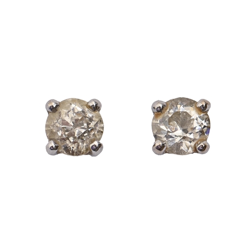 79 - A pair of diamond ear studs, in white gold, 4mm diam, marked 750, 1.3g