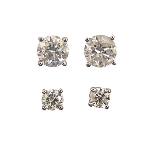 82 - Two pairs of white stone ear studs, in 14ct white gold, 4 and 6mm, 1.9g