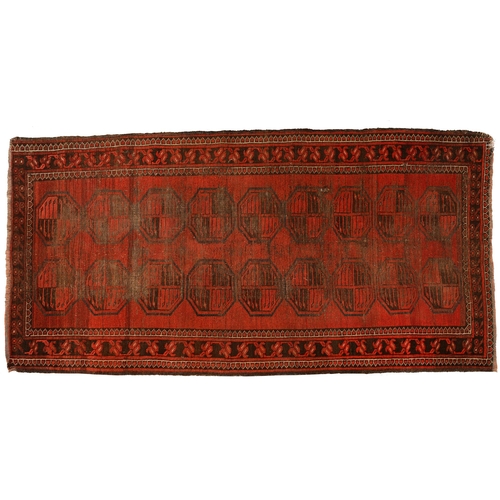 972 - A antique red Afghan Bokhara rug, 194cm x 101cm