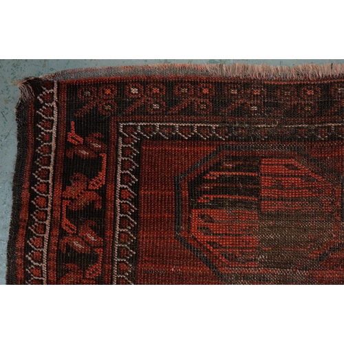 972 - A antique red Afghan Bokhara rug, 194cm x 101cm